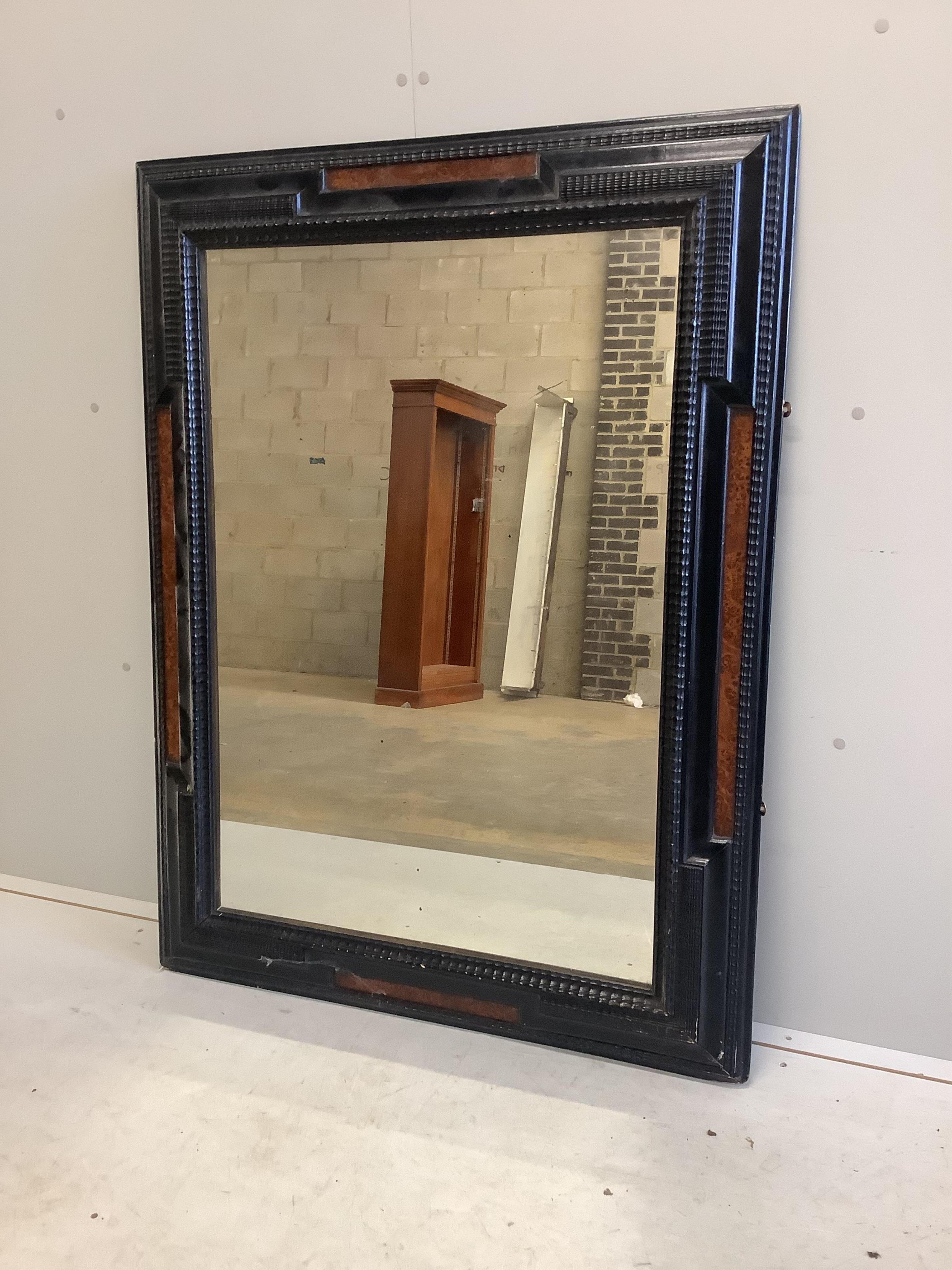 A Dutch style ebonised and amboyna rectangular wall mirror, width 95cm, height 126cm. Condition - fair to good